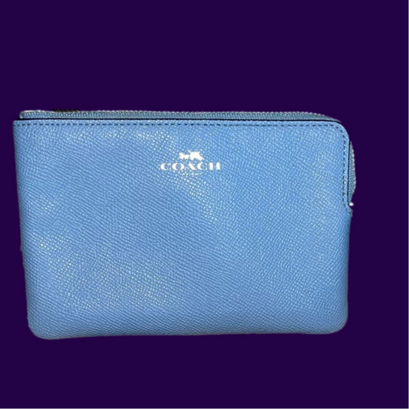 Coach Handbags - COACH Beautiful Baby Blue Wristlet Silver hardware and Logo